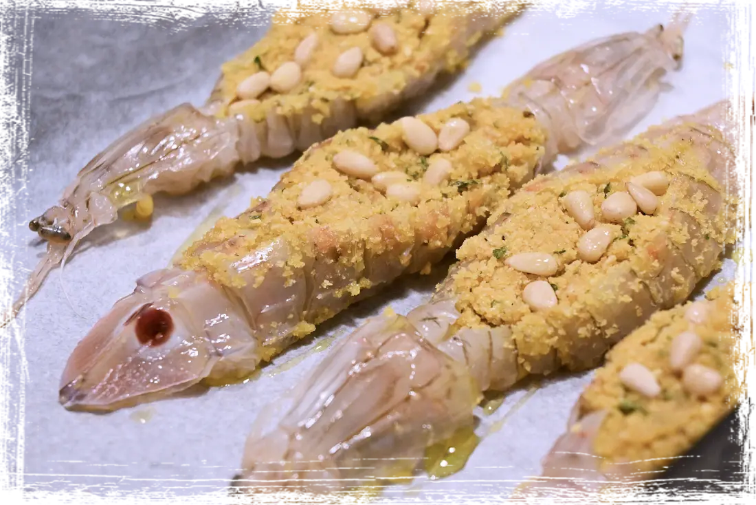 Canocchie al forno con pinoli Canocchie al forno con pinoli