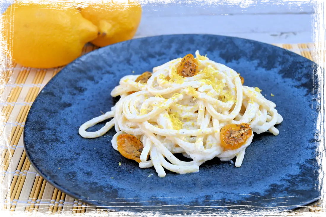 Pici con crema di ricotta al limone e pomodorini confit