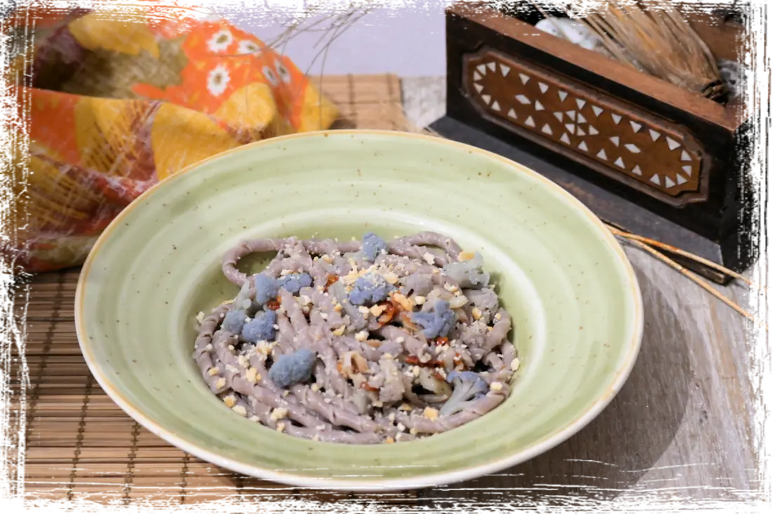 Sagne ritorte al negramaro con cavolfiore, guanciale e pomodori secchi